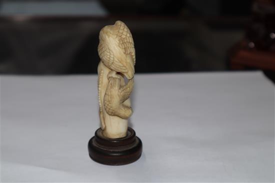 A Japanese ivory cane handle, a faux amber lion-dog and an enamel and ivory pill box